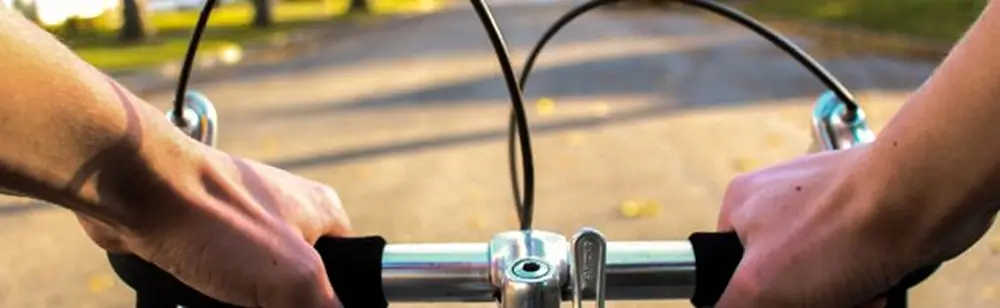 Hands on bicycle handlebars