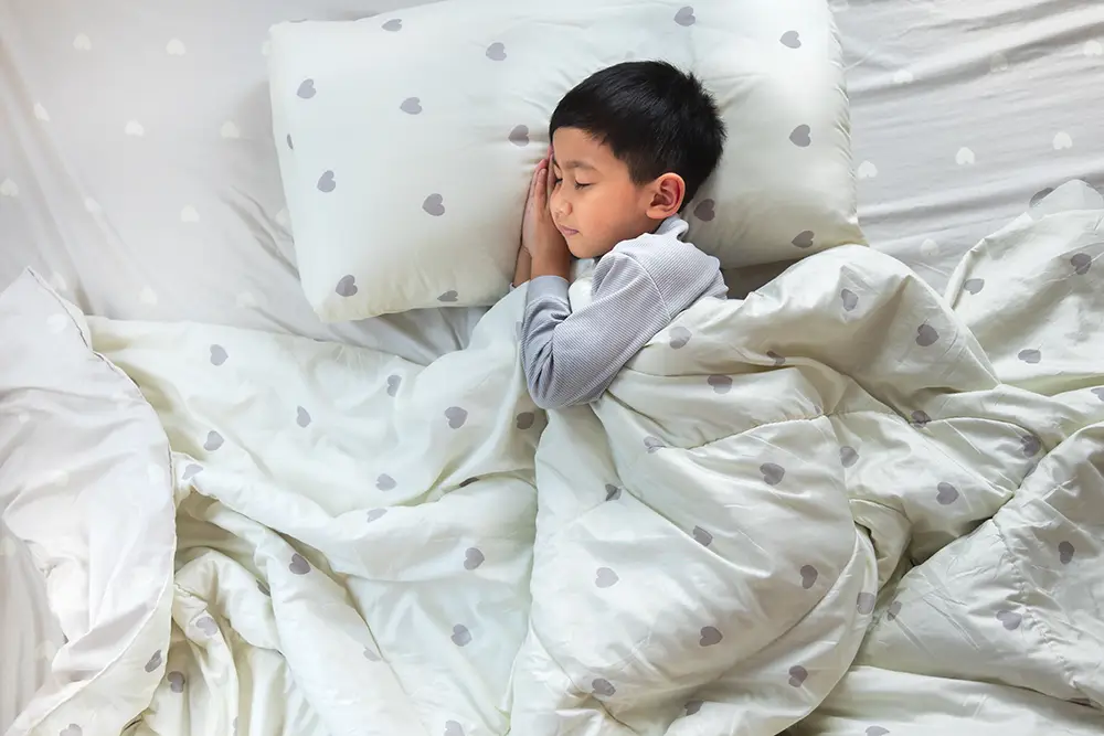 A child sleeping in bed