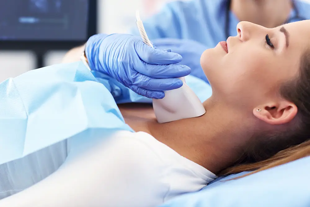 A woman undergoing a thyroid test