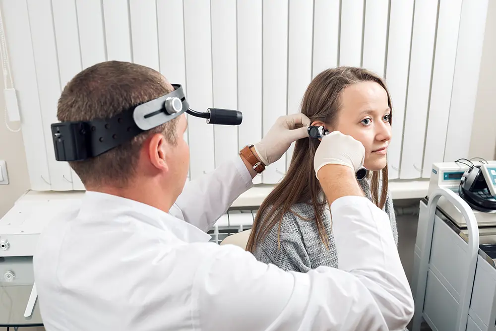 A young woman getting her hearing checked